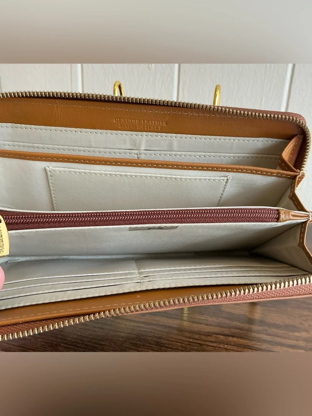 A rare vintage Adrienne Vittadini cognac color zip around leather wallet